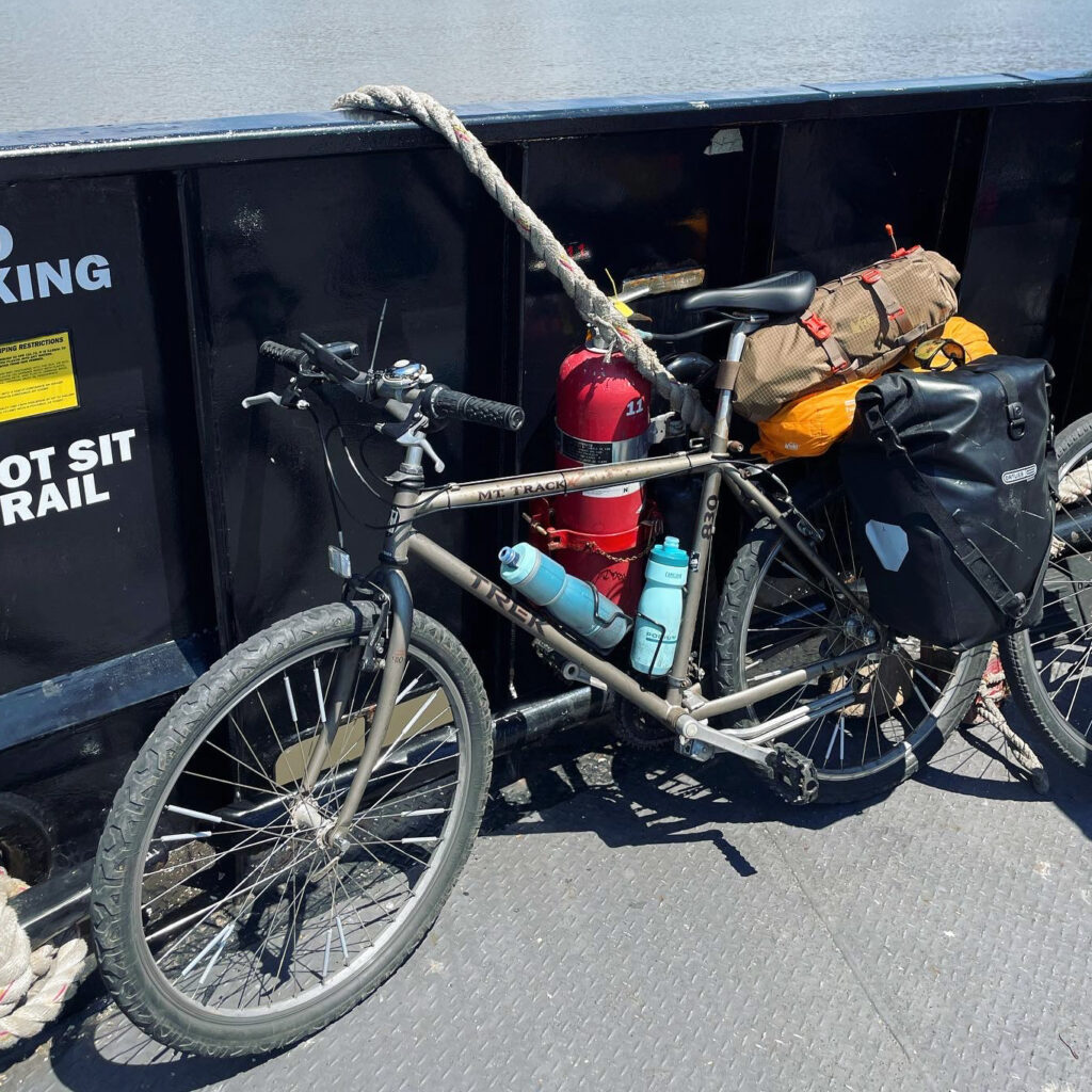 Trek mountain bike with panniers for bikepacking.