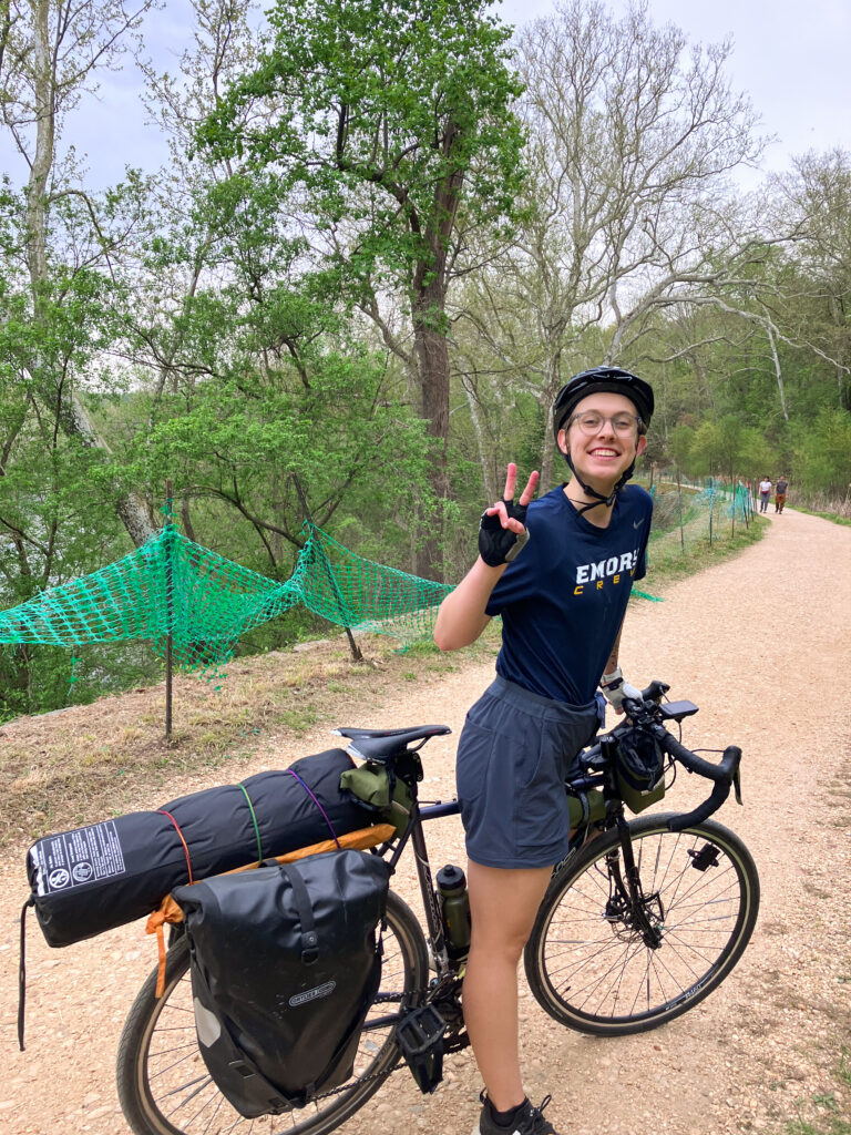 Female cyclist bikepacking with gravel bike on C&O Canal